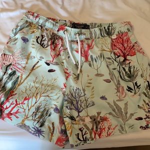 Super comfy coral stretch swim trunks